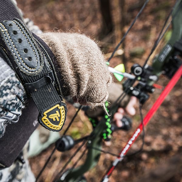 hunting-prostaff-lifestyle-1 close up of hand on bow and arrow
